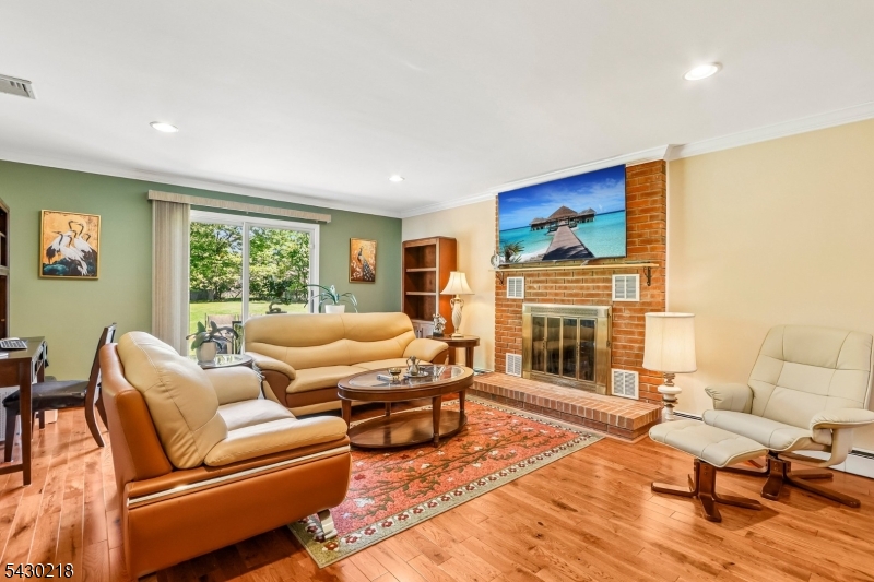 718 New Dover Road Edison, NJ 08820 - Photo 2 of 22 a living room with furniture fireplace and flat screen tv