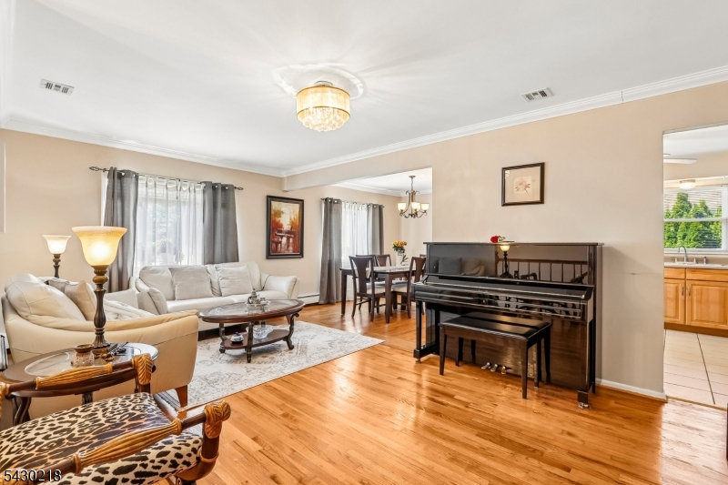 718 New Dover Road Edison, NJ 08820 - Photo 4 of 22 a living room with furniture and wooden floor