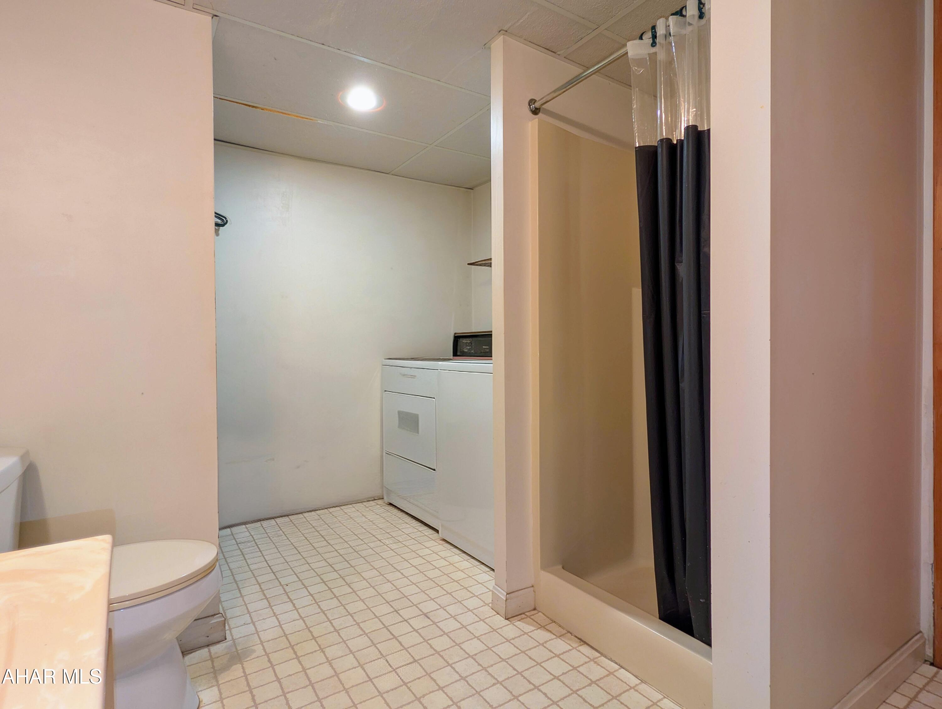 147 Pine Street Hyndman, PA 15545 - Photo 27 of 44 a bathroom with a sink a toilet and shower