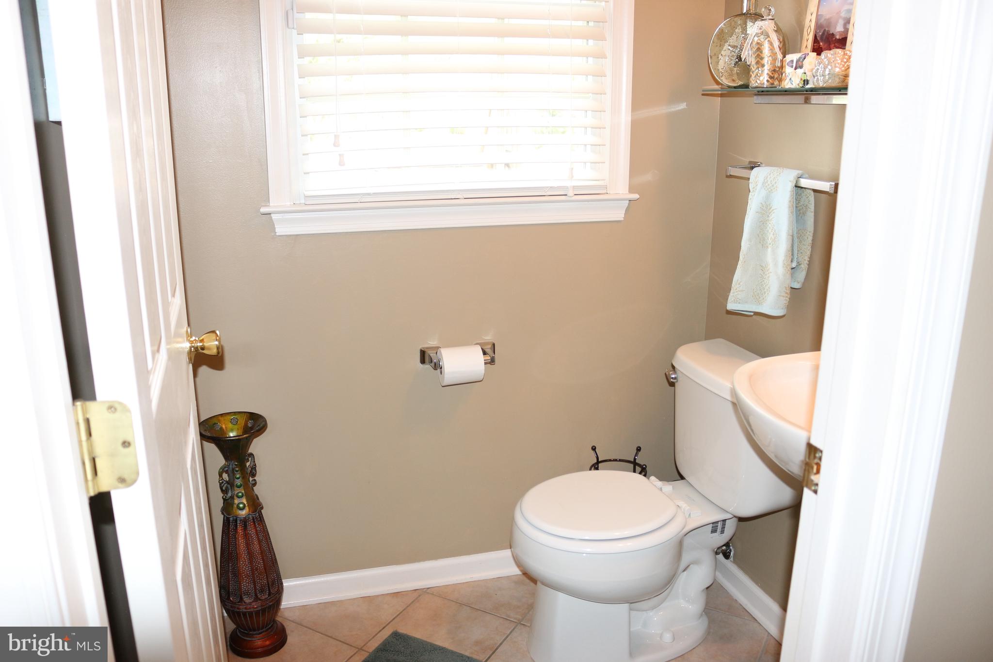 112 Mandalay Drive Bear, DE 19701 - Photo 11 of 22 Convenient Main Level Power Room w/ Tile Flooring