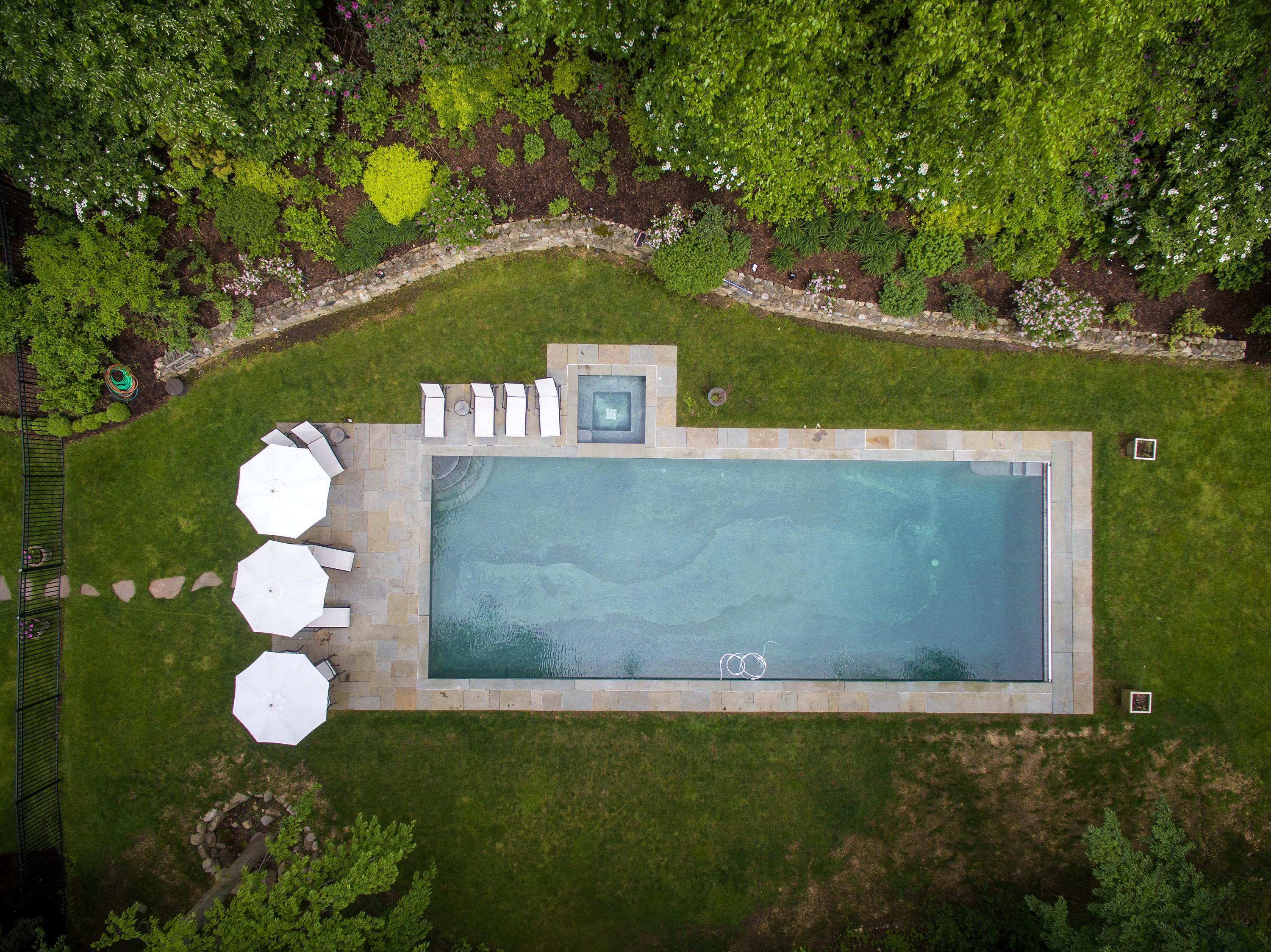 104 Logan Road New Canaan, CT 06840 - Photo 29 of 34 a view of swimming pool in a yard