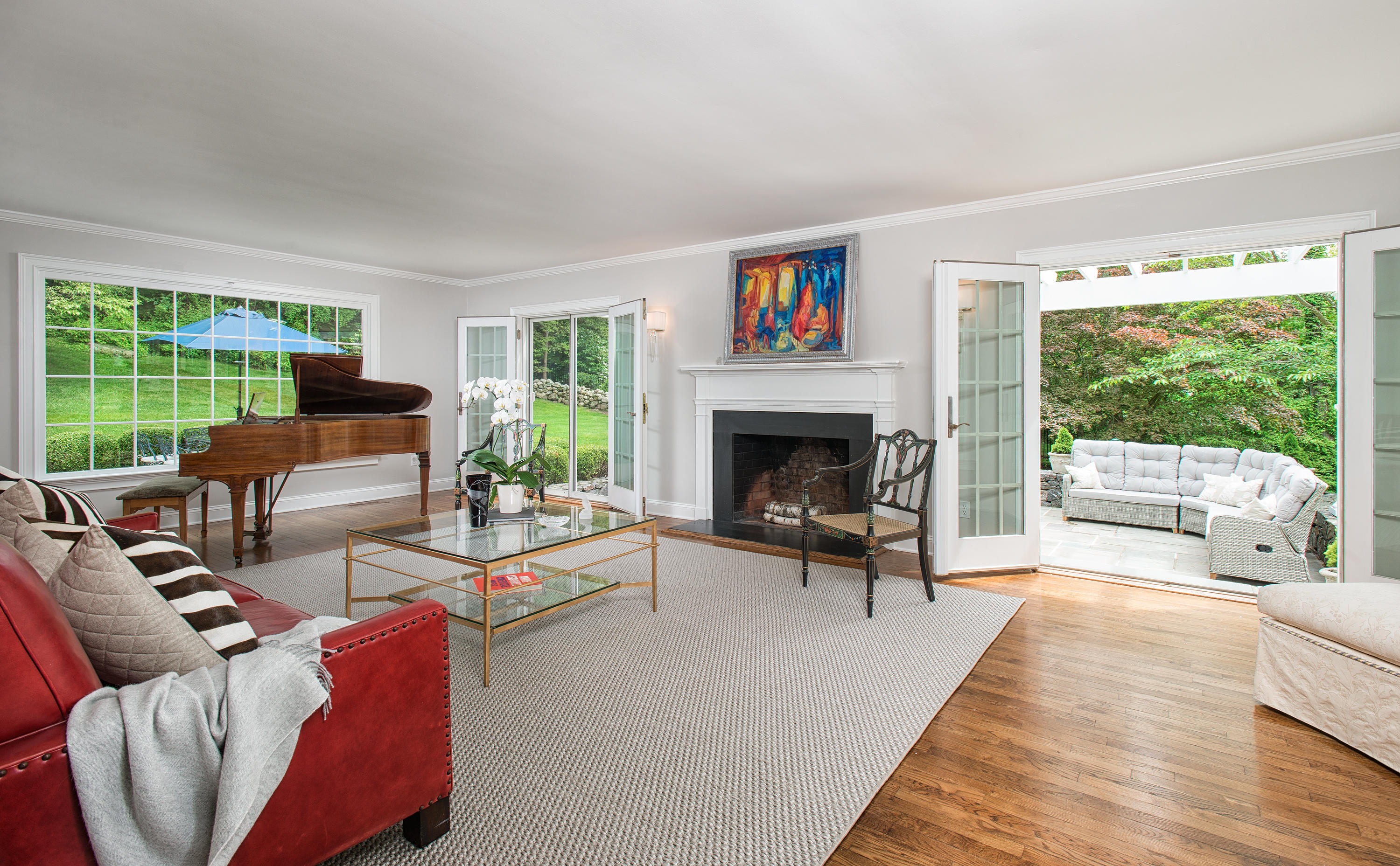 104 Logan Road New Canaan, CT 06840 - Photo 4 of 34 a living room with furniture large window and a fireplace