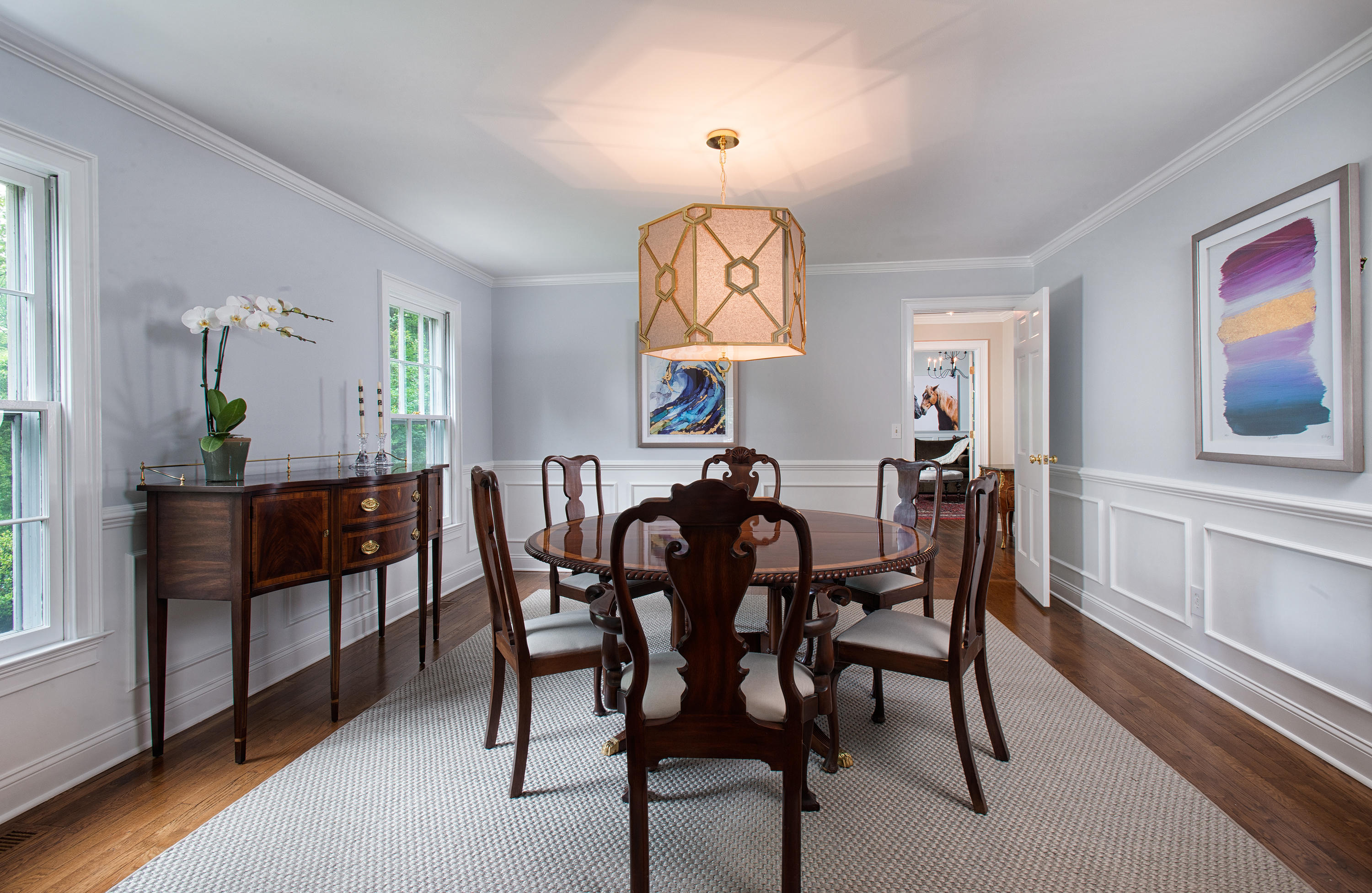 104 Logan Road New Canaan, CT 06840 - Photo 5 of 34 a view of a a dining room with furniture window and wooden floor