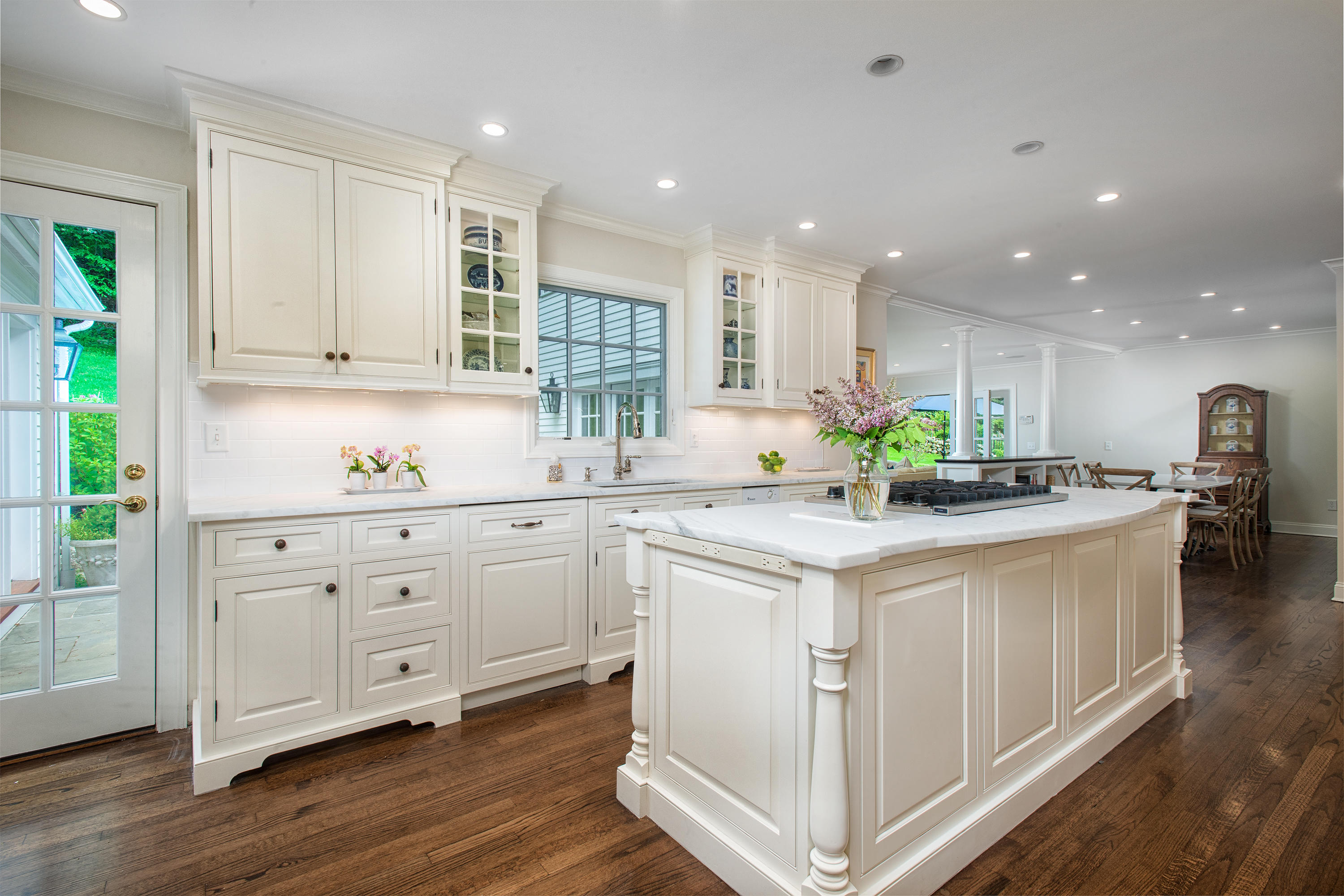 104 Logan Road New Canaan, CT 06840 - Photo 8 of 34 a kitchen with granite countertop white cabinets and white appliances