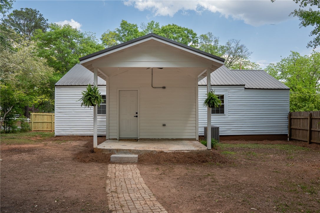 1312 Rocky Brook Road Opelika, AL 36801 - Photo 32 of 45 This charming home offers a simple yet inviting exterior with a covered porch.