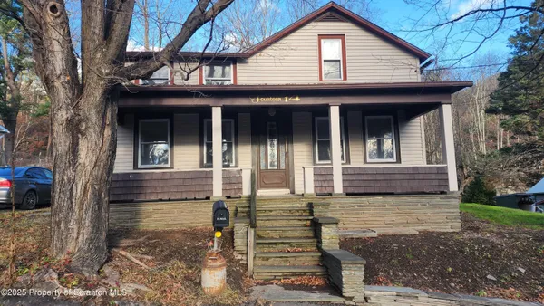 a front view of a house with garage