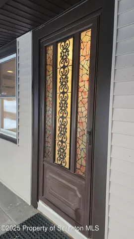 a view of entryway with a door