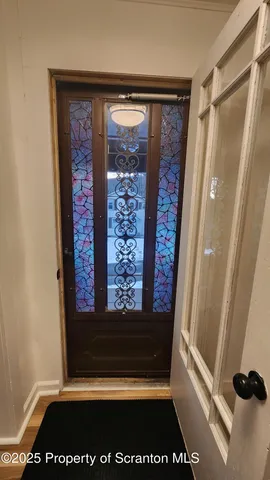 a view of an empty room with glass door