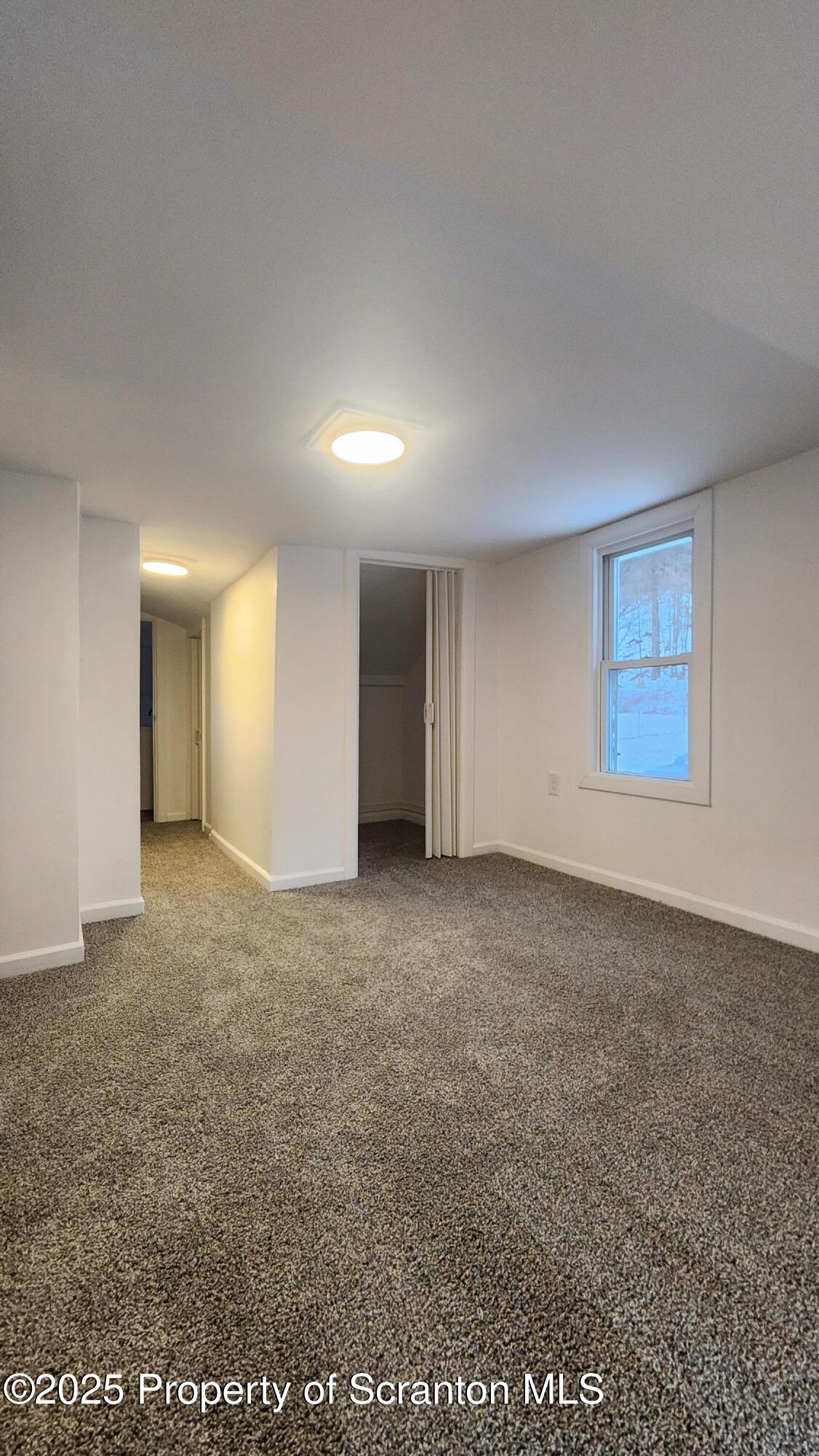38 Prospect Street Hop Bottom, PA 18824 - Photo 15 of 41 a view of an empty room with glass door