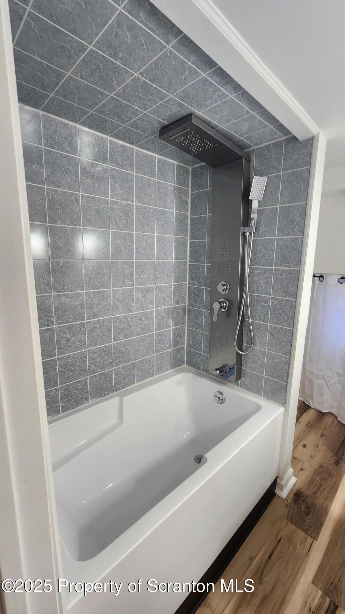 38 Prospect Street Hop Bottom, PA 18824 - Photo 21 of 41 a bath tub sitting next to a white sink