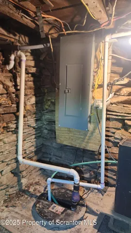 a view of a house with a wooden fence