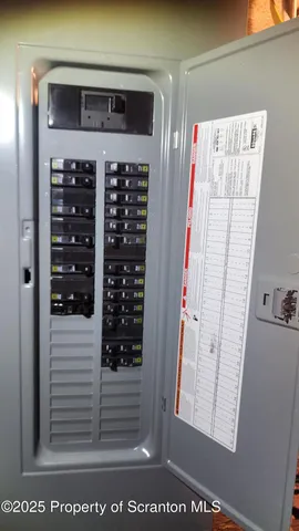 a view of a livingroom with a table and chairs