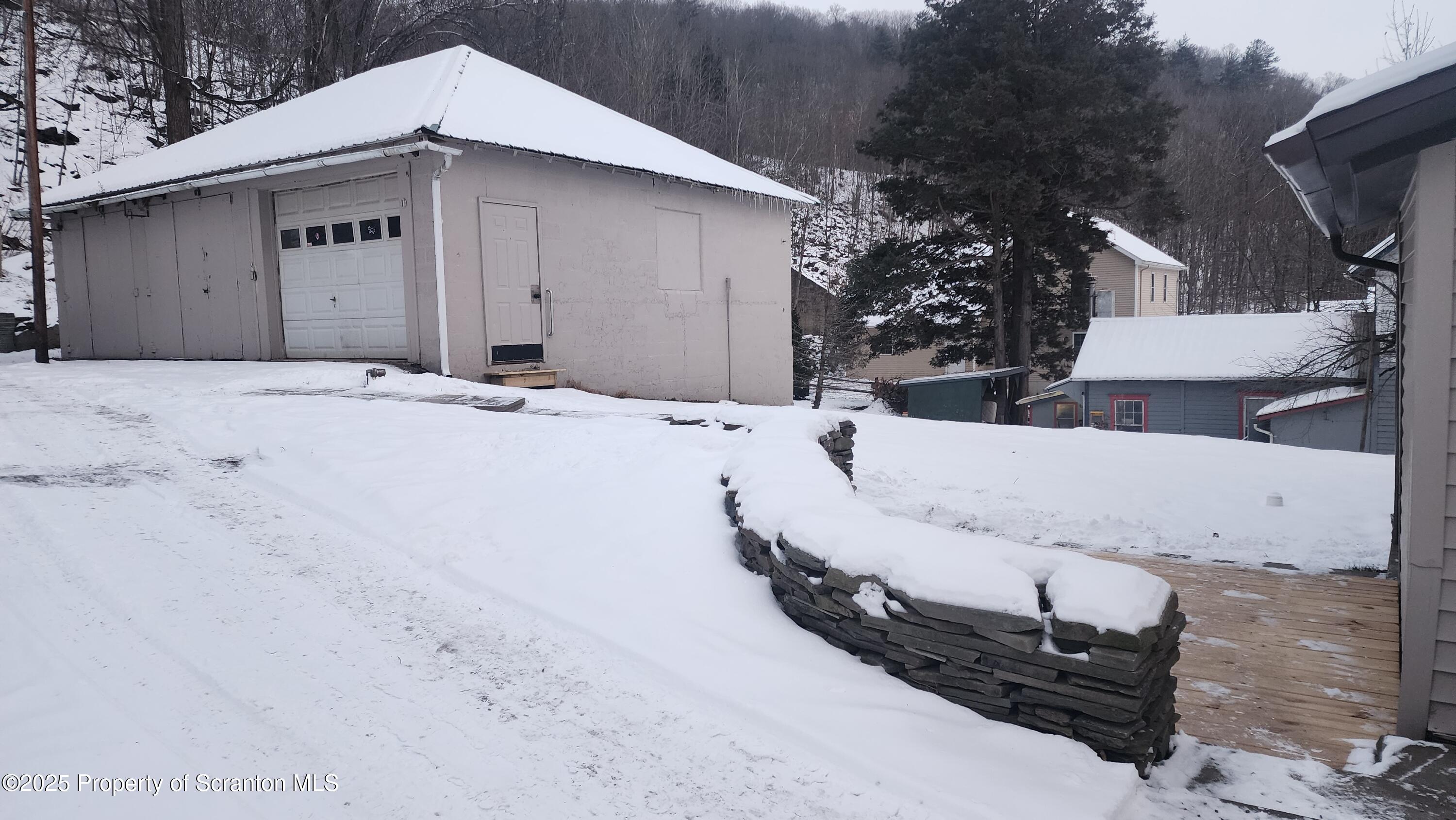 38 Prospect Street Hop Bottom, PA 18824 - Photo 33 of 41 a view of a house with a wooden fence