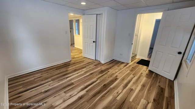 a view of a room with wooden floor and chair