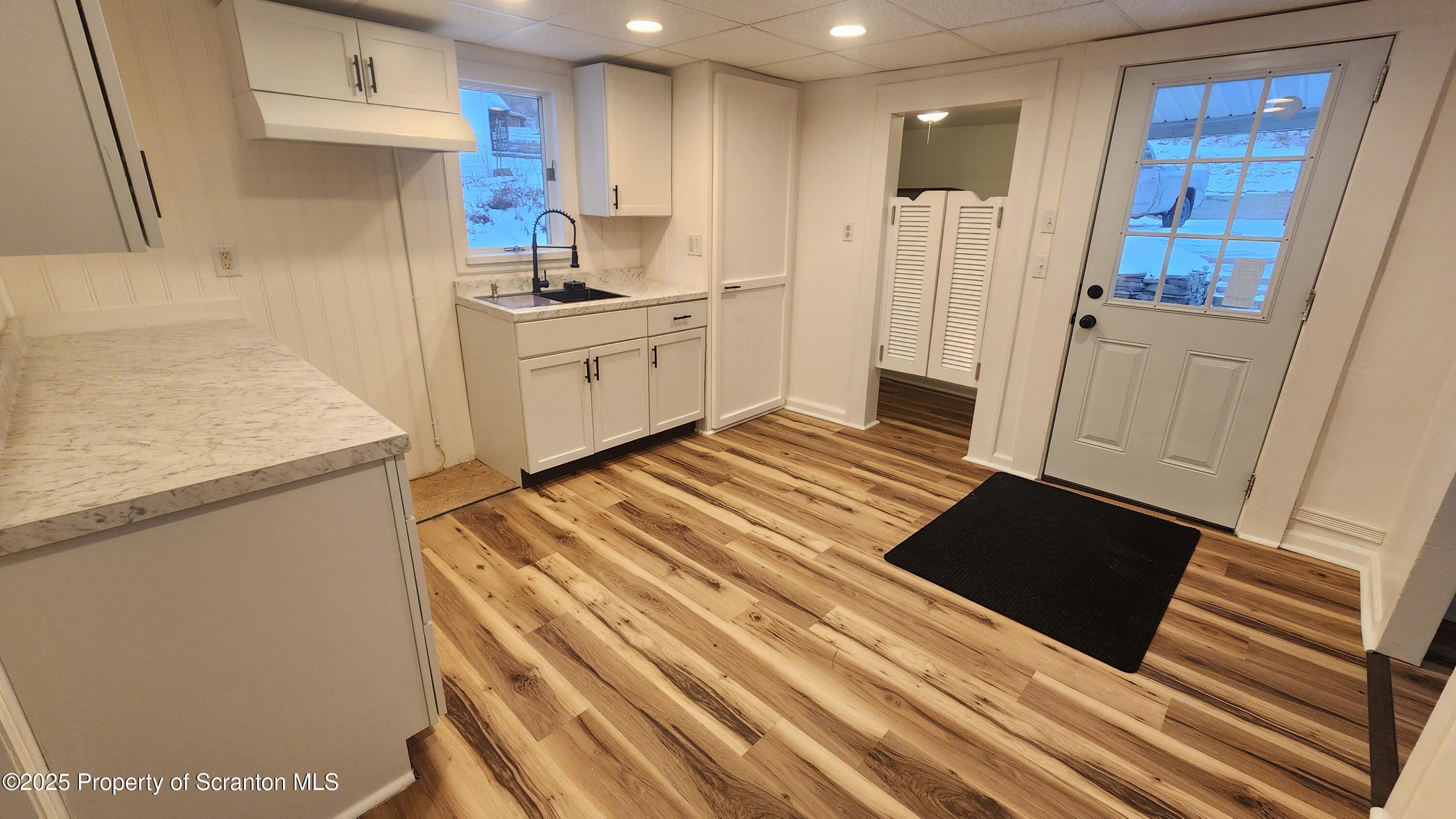 38 Prospect Street Hop Bottom, PA 18824 - Photo 7 of 41 a kitchen with stainless steel appliances a refrigerator and a stove