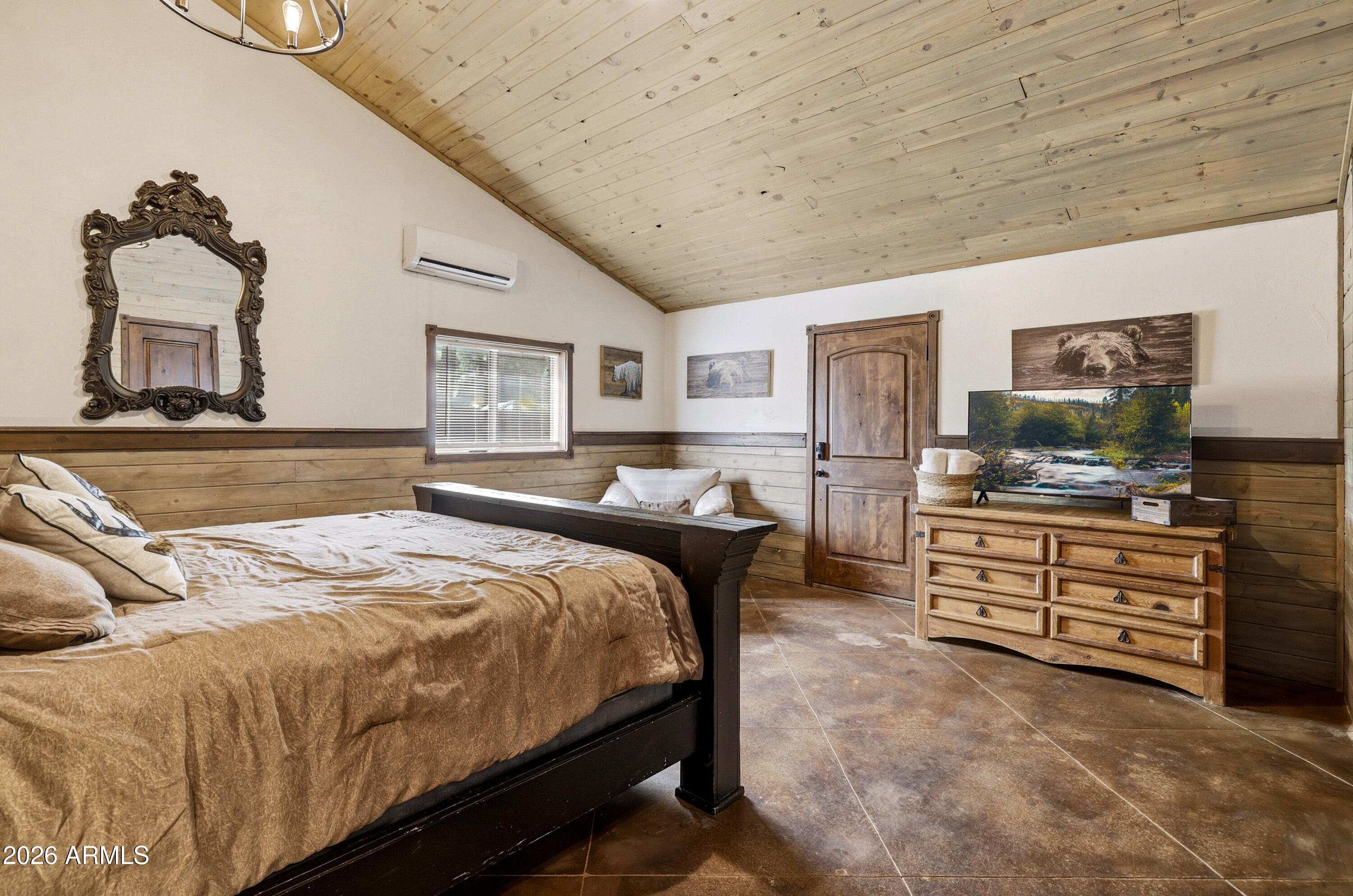 4971 Buck Springs Road Pinetop, AZ 85935 - Photo 16 of 32 a bedroom with a bed and flat screen tv