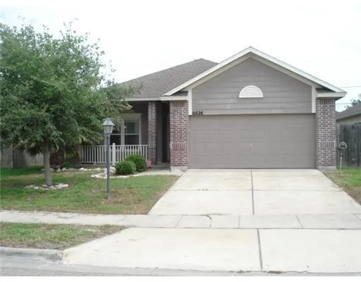 a front view of house with garage and yard