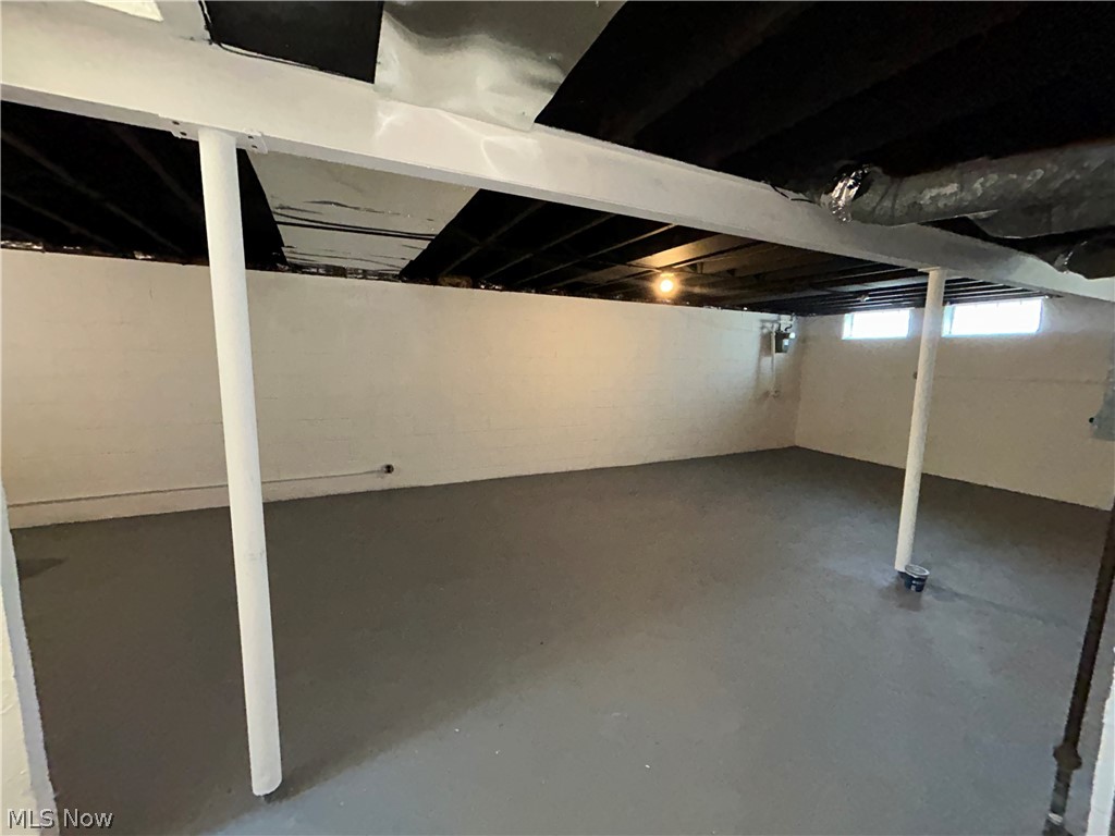 9316 Alexander Road Garfield Heights, OH 44125 - Photo 18 of 27 Finished concrete flooring with painted block walls