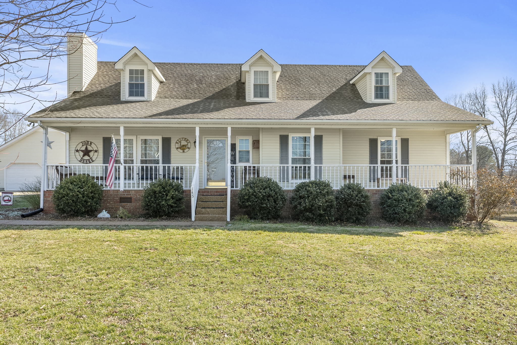 145 Kilgore Trace Cross Plains, TN 37049 - Photo 1 of 34 a front view of a house with garden