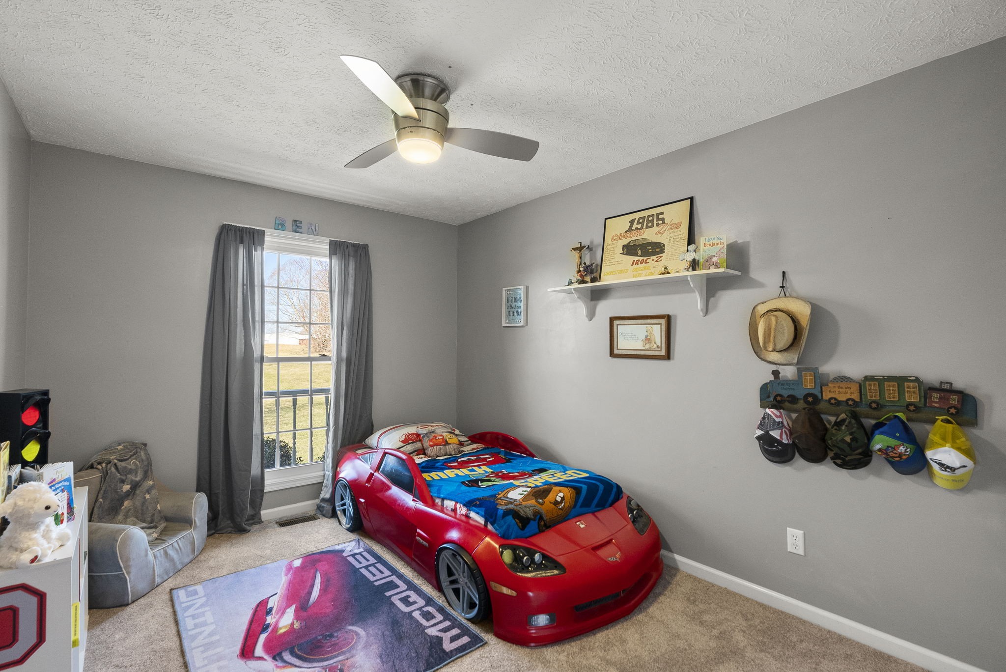 145 Kilgore Trace Cross Plains, TN 37049 - Photo 17 of 34 a bedroom with a bed and a chandelier