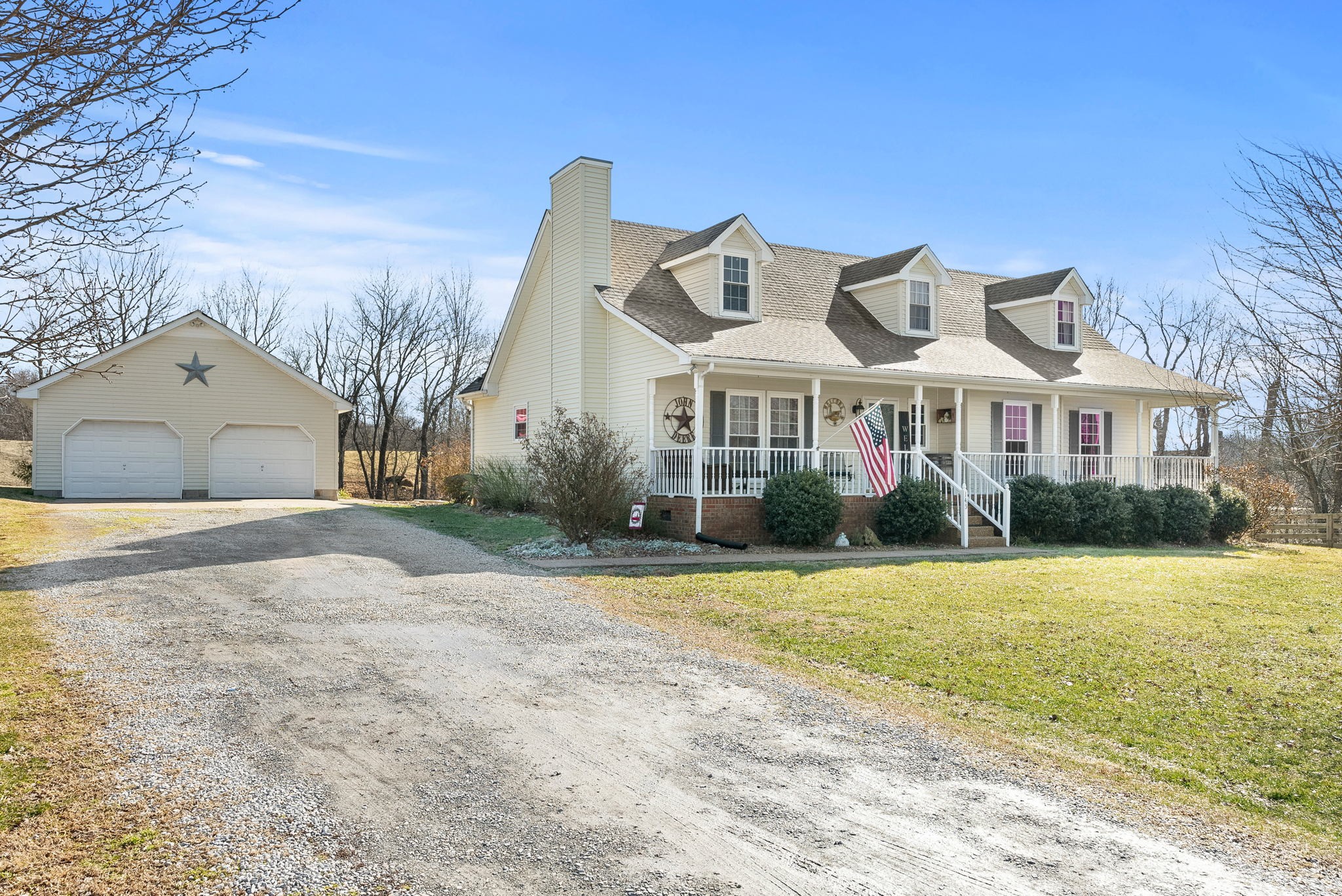 145 Kilgore Trace Cross Plains, TN 37049 - Photo 4 of 34 a front view of a house with a yard and garage
