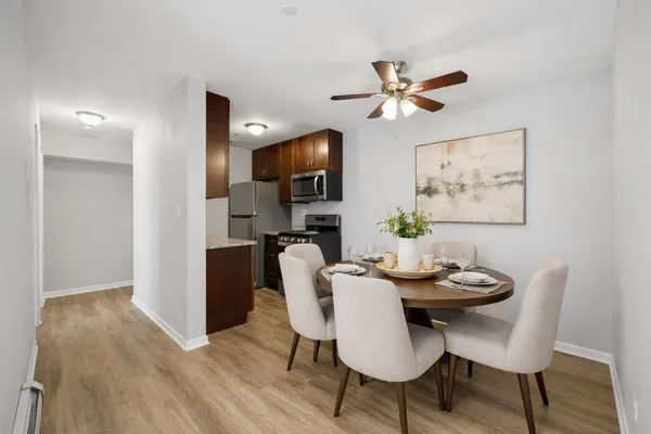 a view of a dining room with furniture and wooden floor