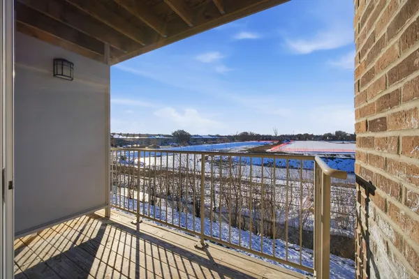 a view of balcony with wooden floor