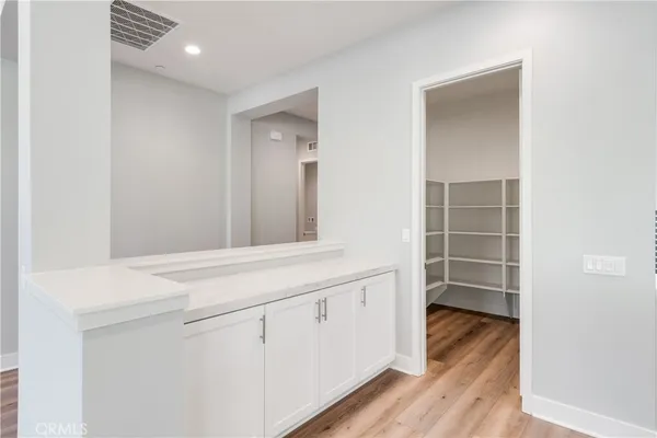a view of cabinets with wooden floor