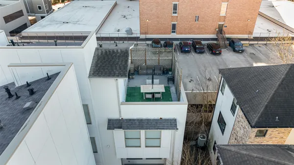 a balcony with table and chairs