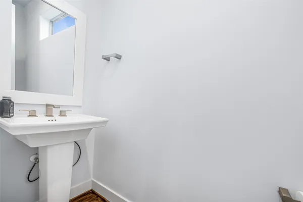 a bathroom with a sink a mirror and vanity
