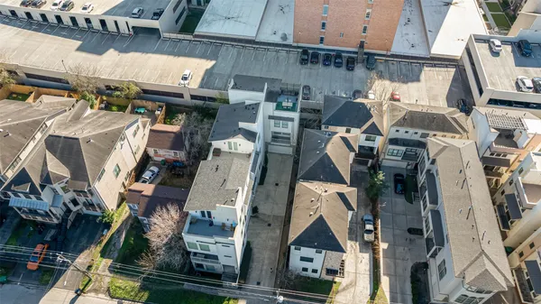 an aerial view of residential houses with outdoor space