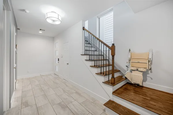 a view of entryway with wooden floor