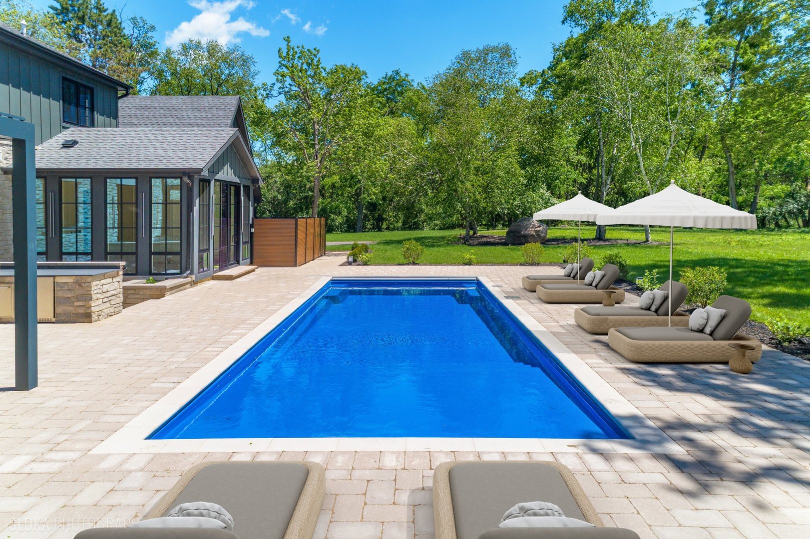 699 Plum Tree Road Barrington Hills, IL 60010 - Photo 4 of 84 a view of swimming pool with lounge chair under an umbrella