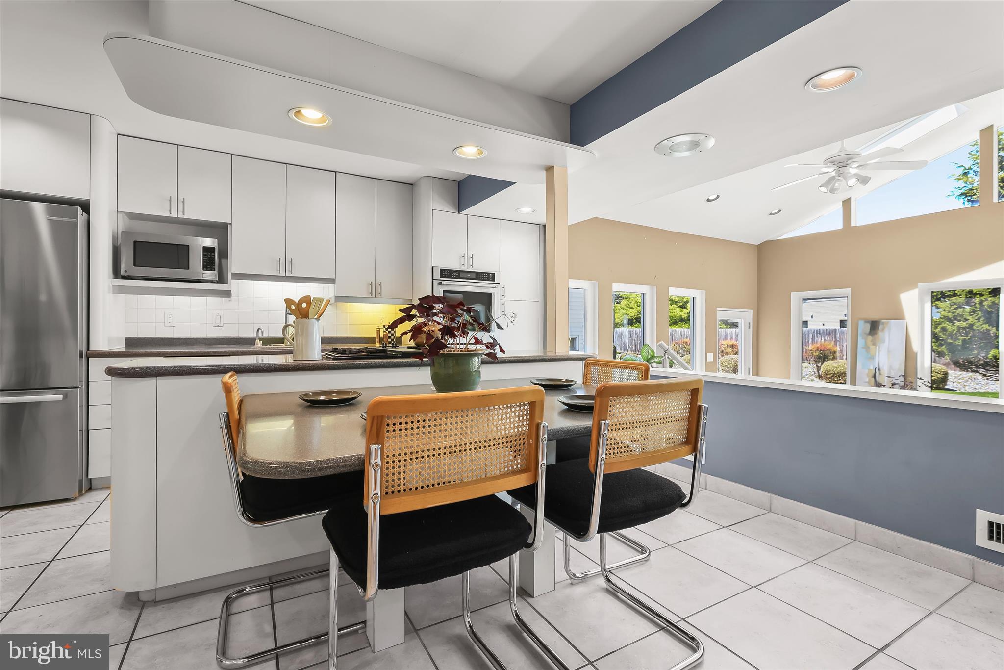 3408 Old Post Drive Baltimore, MD 21208 - Photo 21 of 81 a kitchen with granite countertop cabinets and chairs