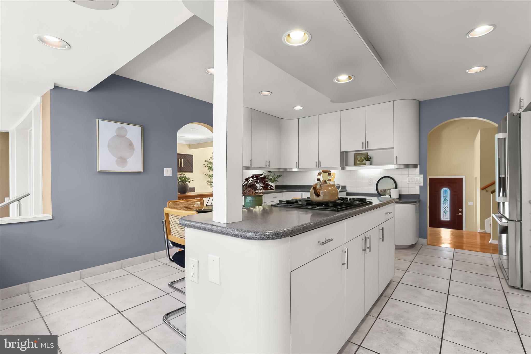 3408 Old Post Drive Baltimore, MD 21208 - Photo 24 of 81 a kitchen with stainless steel appliances granite countertop a sink stove and cabinets