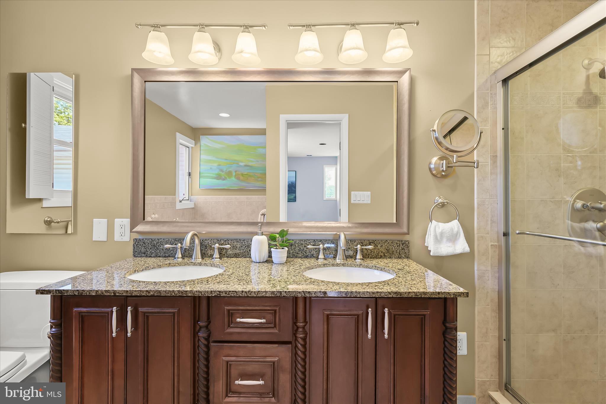 3408 Old Post Drive Baltimore, MD 21208 - Photo 43 of 81 a bathroom with a double vanity sink and a mirror