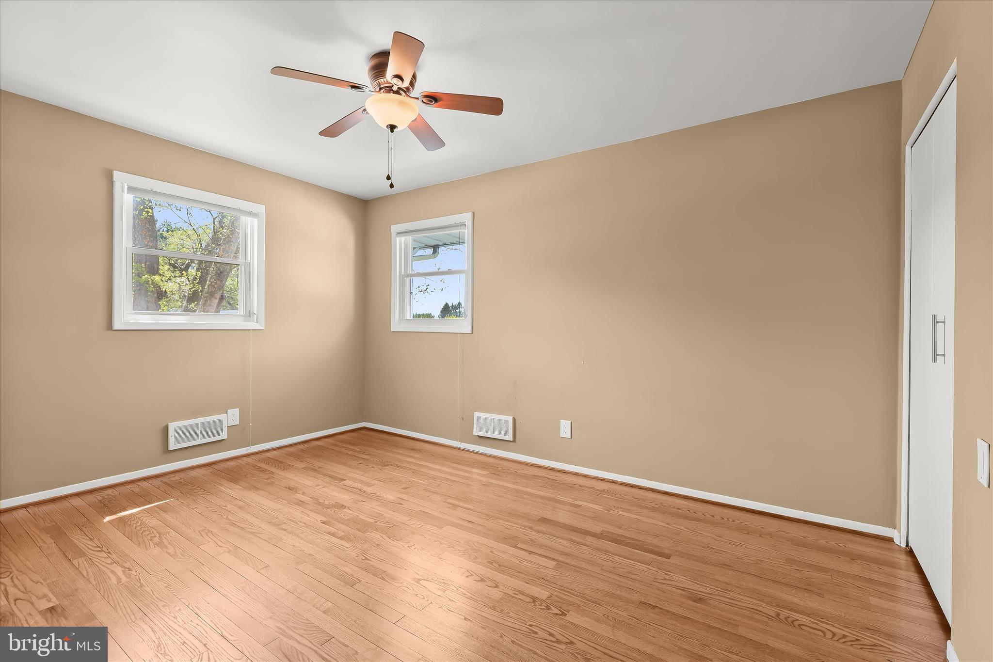 3408 Old Post Drive Baltimore, MD 21208 - Photo 50 of 81 a view of an empty room with window and a ceiling fan