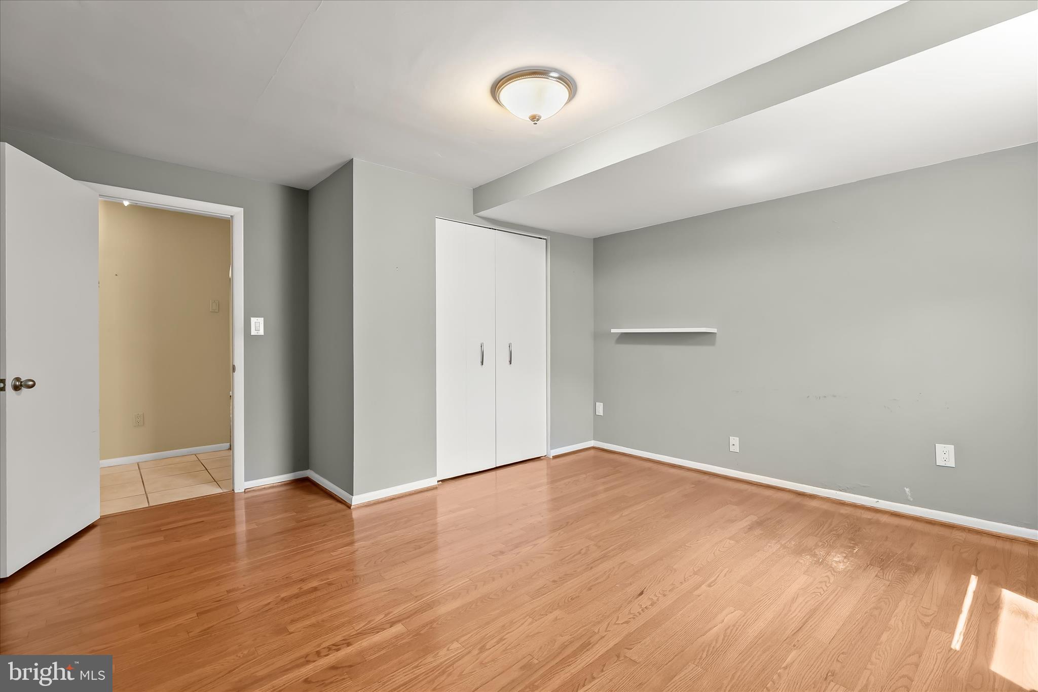 3408 Old Post Drive Baltimore, MD 21208 - Photo 62 of 81 an empty room with wooden floor and windows