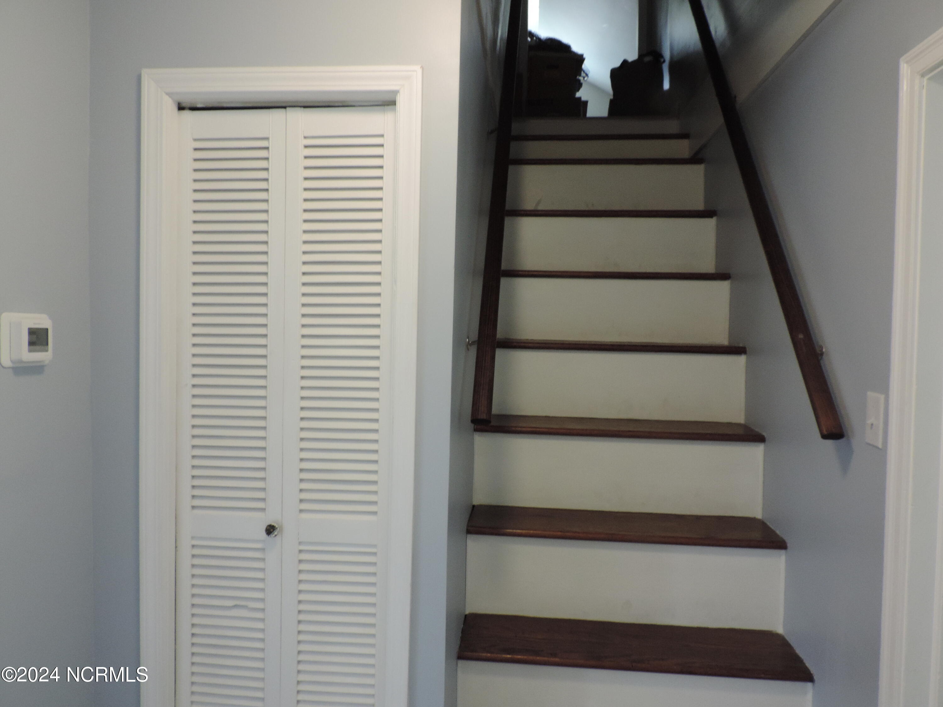 111 Stratford Road Jacksonville, NC 28540 - Photo 18 of 44 Stairs to Storage on the Upper Level