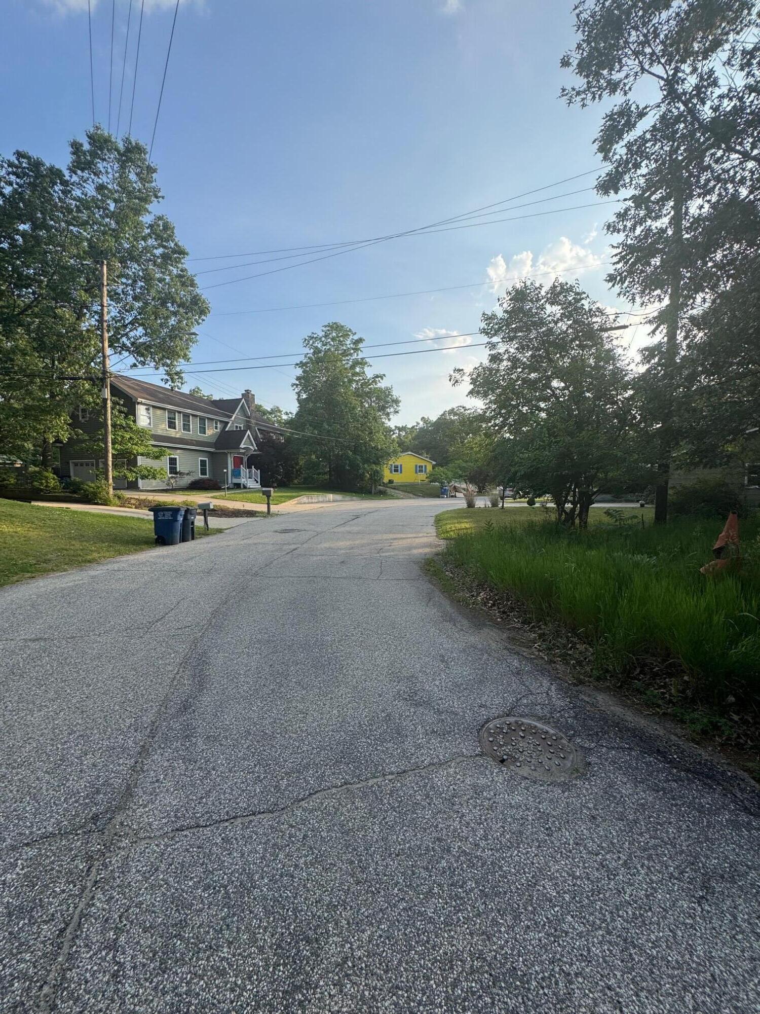 a view of a road with a yard