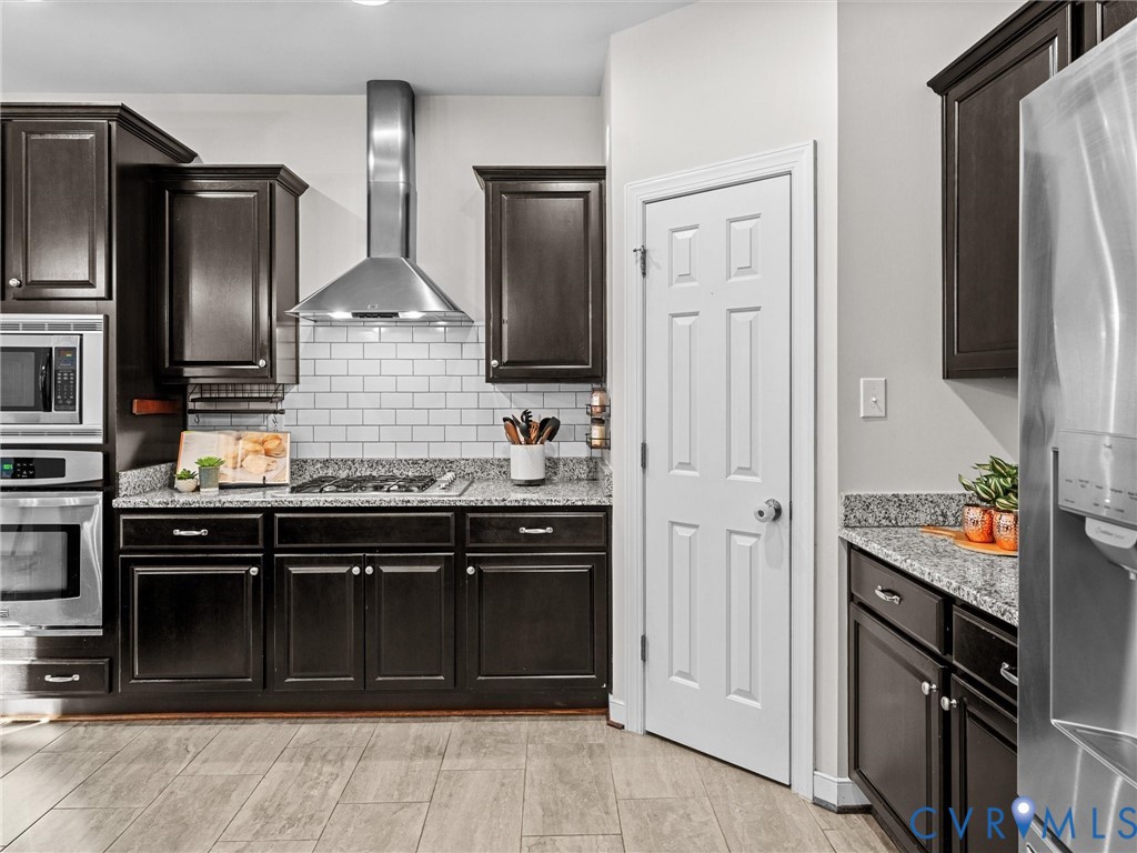 16101 Longlands Road Chesterfield, VA 23832 - Photo 14 of 48 a kitchen with stainless steel appliances granite countertop a refrigerator and a stove