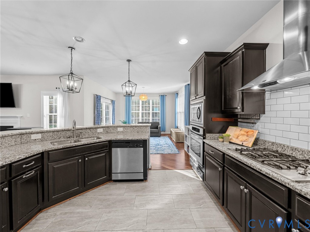 16101 Longlands Road Chesterfield, VA 23832 - Photo 15 of 48 a large kitchen with granite countertop a stove and a sink