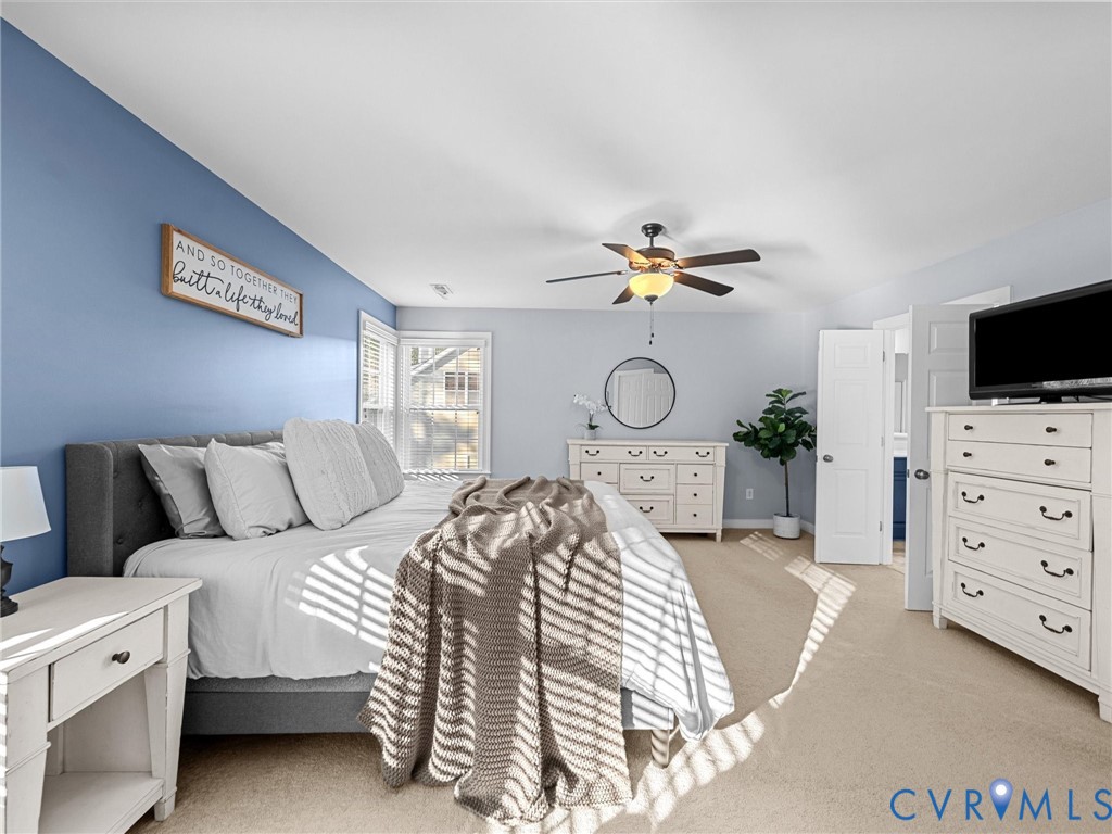 16101 Longlands Road Chesterfield, VA 23832 - Photo 19 of 48 a bedroom with a bed and a flat screen tv