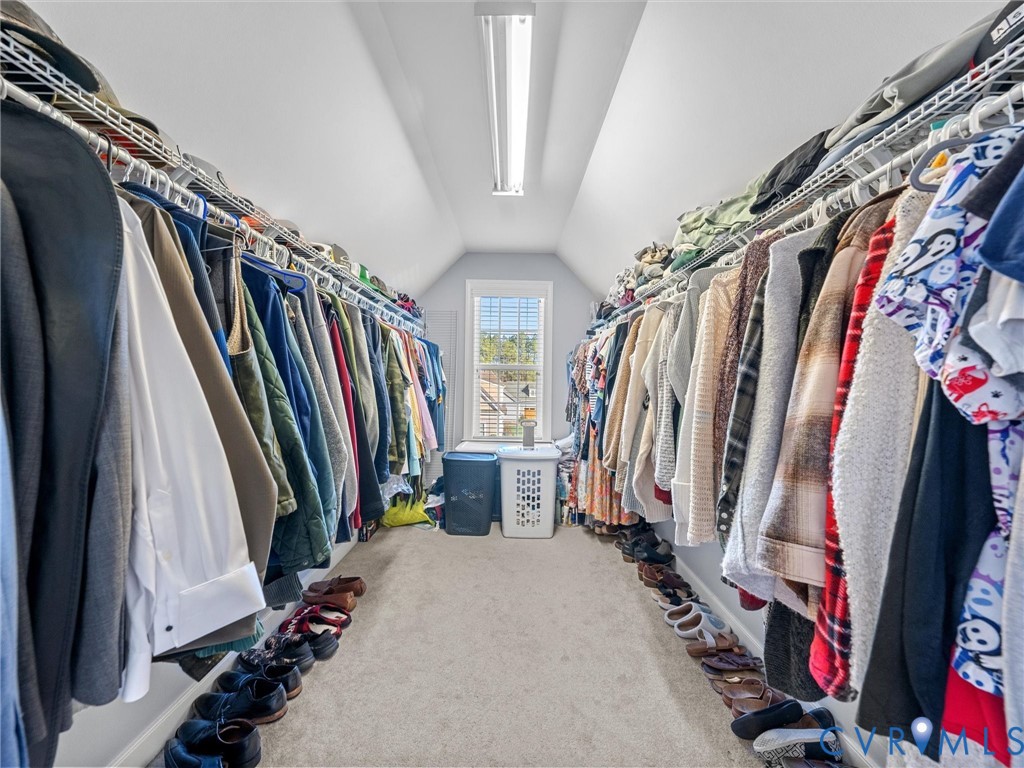 16101 Longlands Road Chesterfield, VA 23832 - Photo 22 of 48 a view of walk in closet with clothes and shoes