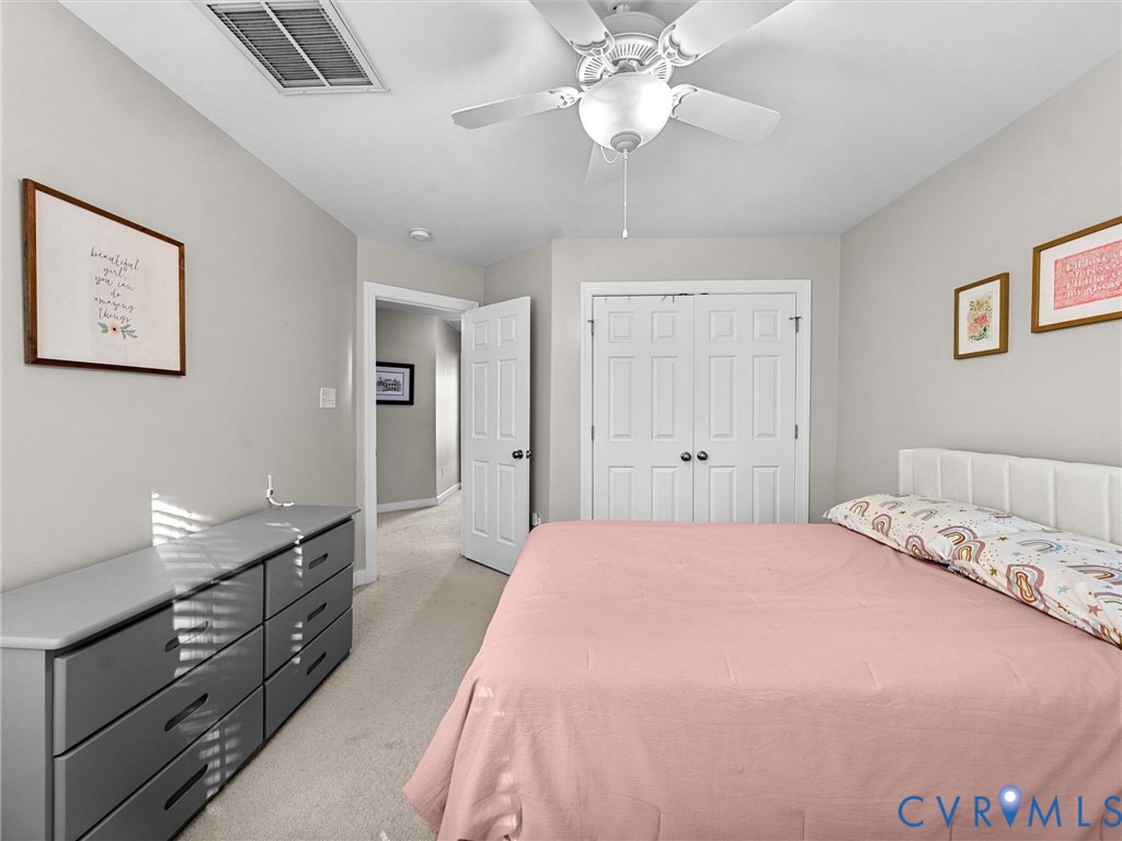 16101 Longlands Road Chesterfield, VA 23832 - Photo 24 of 48 a bedroom with a large bed and a chandelier