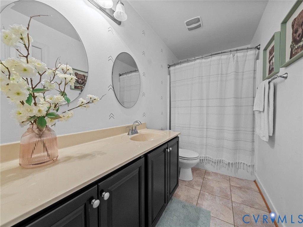 16101 Longlands Road Chesterfield, VA 23832 - Photo 25 of 48 a bathroom with a granite countertop sink a toilet and a shower