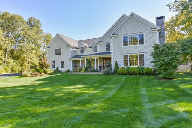 243 Thunder Lake Road Wilton, CT 06897 - Photo 1 of 1 a front view of a house with a yard