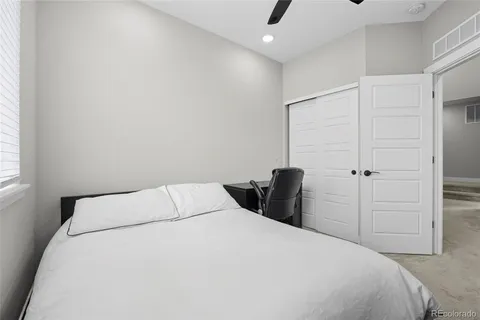 a bedroom with a bed and a closet