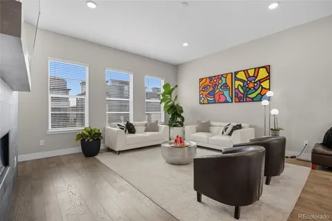 a living room with furniture and windows