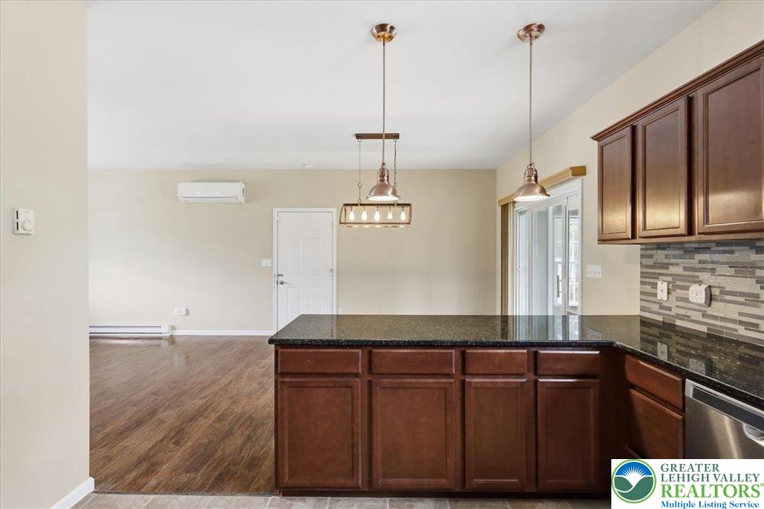 64 Robertson Road Jim Thorpe, PA 18229 - Photo 22 of 54 a kitchen with granite countertop a sink and a wooden floor